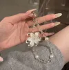 Fashionable short transparent flower phone chain, beaded crystal pendant, cotton rope phone lanyard Specification image